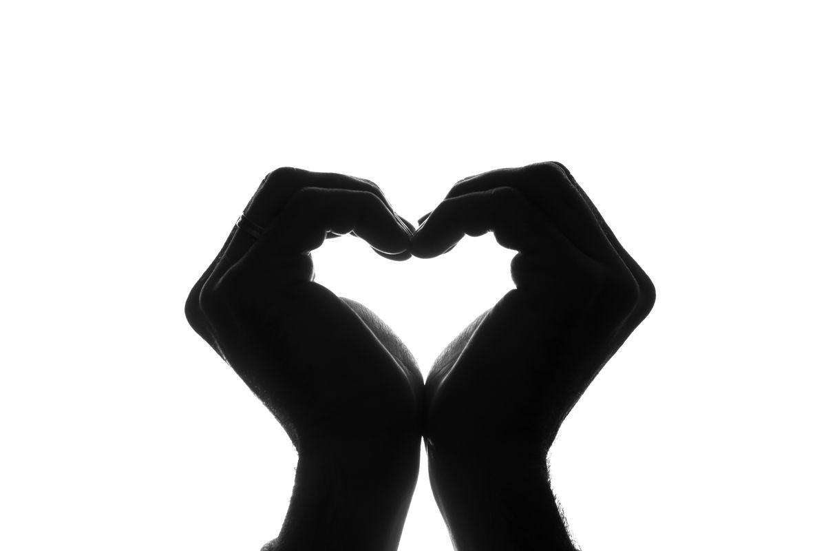 Male hands as a symbol of the heart - silhouette
